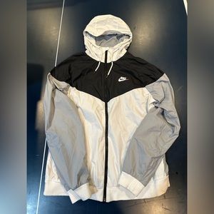 Nike Windbreaker. Small unnoticeable stain on left cuff.